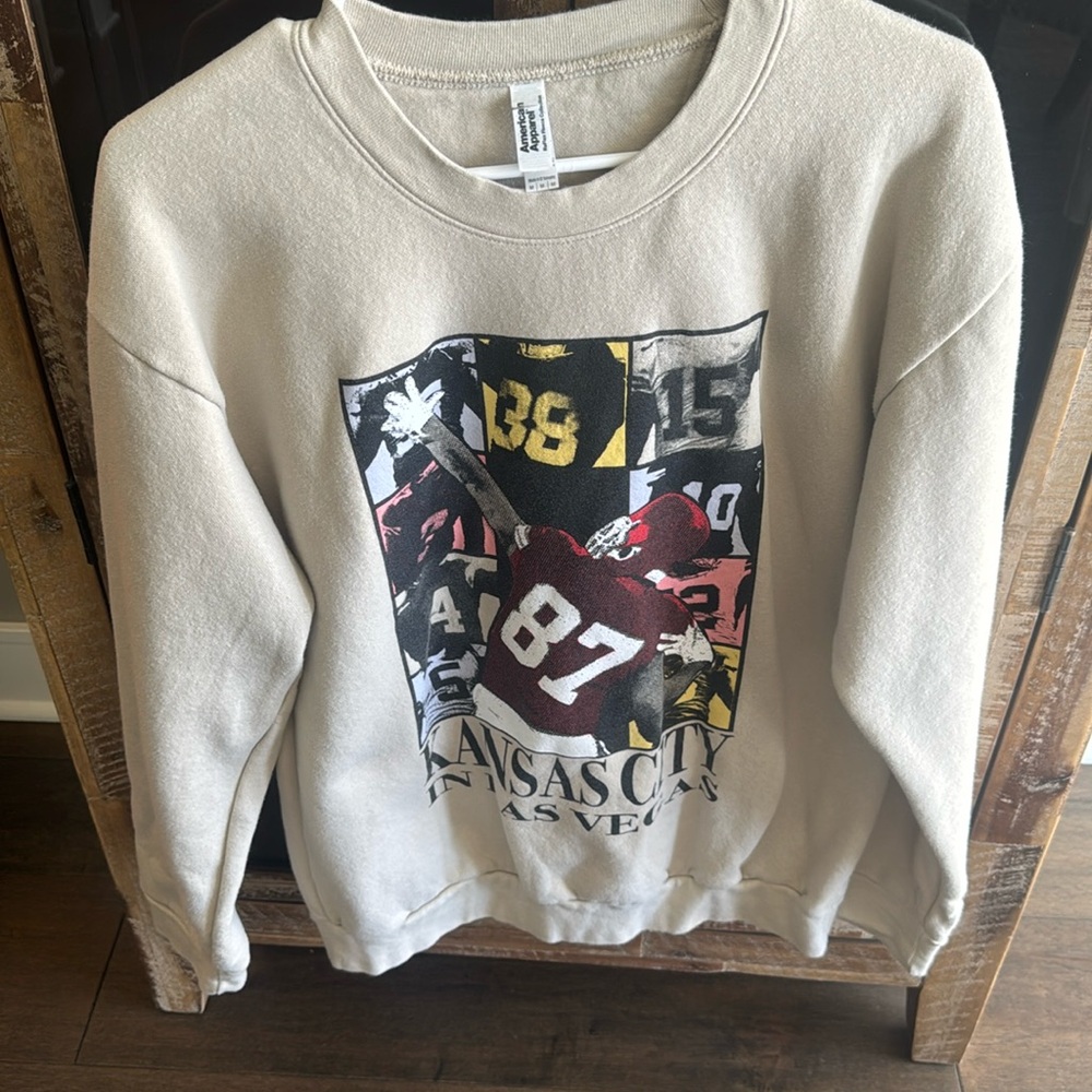 Travis Kelce with Taylor Swift Eras Tour Sweatshirt